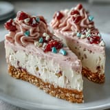 Velvety cream cheese and airy whipped cream fill a buttery graham cracker crust under a pastel crown of crunchy candy hearts.