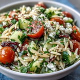 Vibrant Summer Orzo Salad with feta, bursting with Mediterranean flavors and crisp veggies.