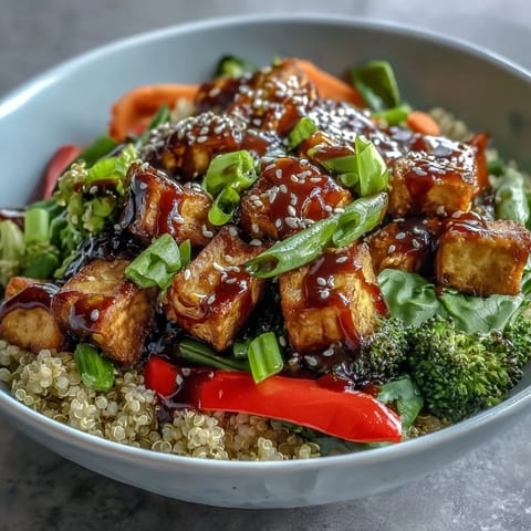 Topped with sesame seeds and green onions, this wholesome Quinoa Vegetable Teriyaki Bowl is served for a nutritious meal.
