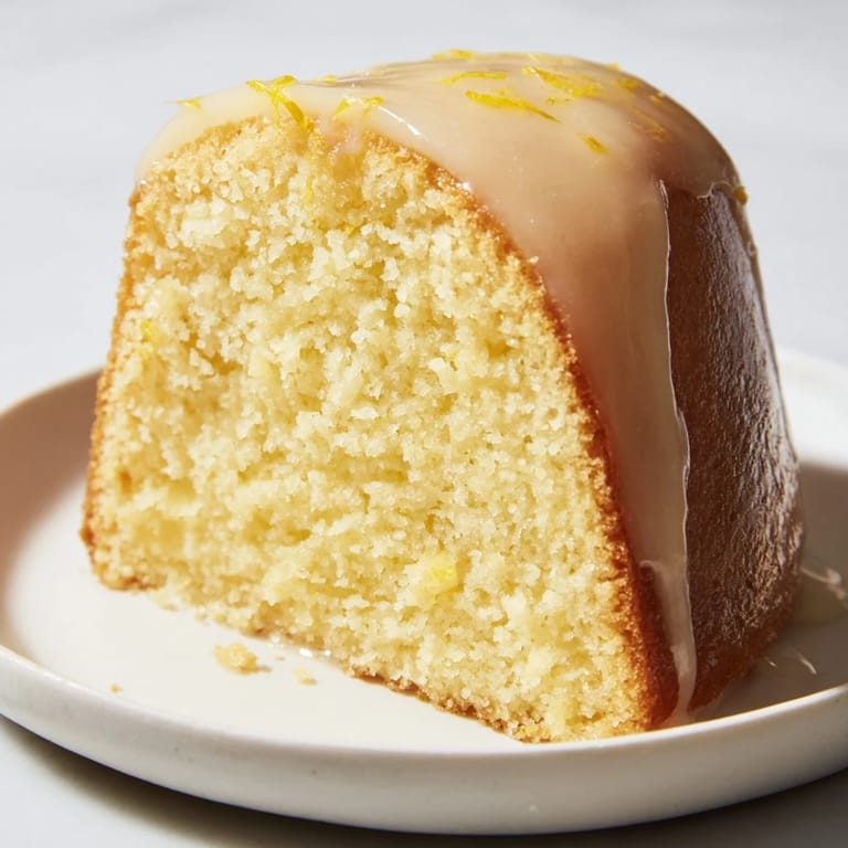 A freshly baked Lemon Pound Cake, wonderfully dense and moist, ideal for a dessert treat.