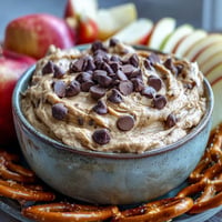 Creamy fiber-packed chickpea cookie dough dip served with fresh apple slices.